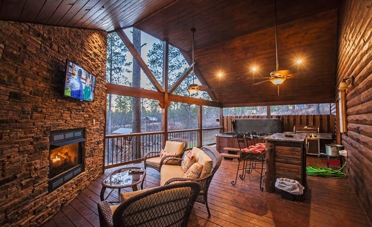 Mountain Melody Back deck with fireplace, seating, bar area, and hot tub