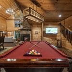 pool table in open living and kitchen area