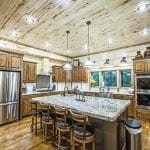 Kitchen with large island, stainless appliances and double oven