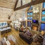 Large great room with chandelier & wood burning fireplace