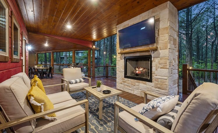 Outdoor furniture with TV over fireplace