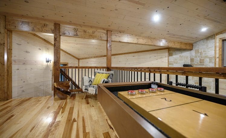 Upstair loft with seating and TV and Shuffle Board