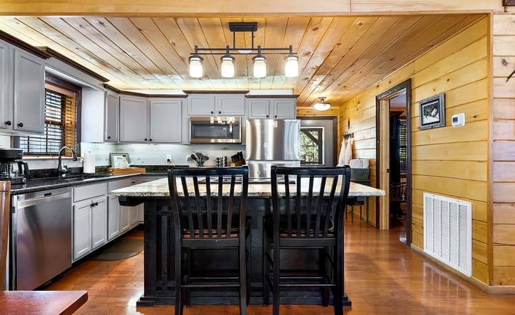 Kitchen with cooking island and seating