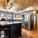 Kitchen with cooking island and seating