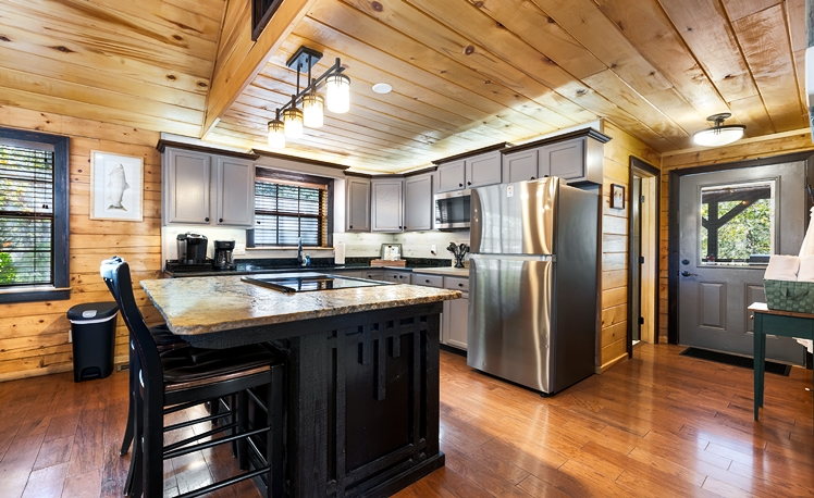 Kitchen with cooking island and seating