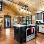 Kitchen with cooking island and seating