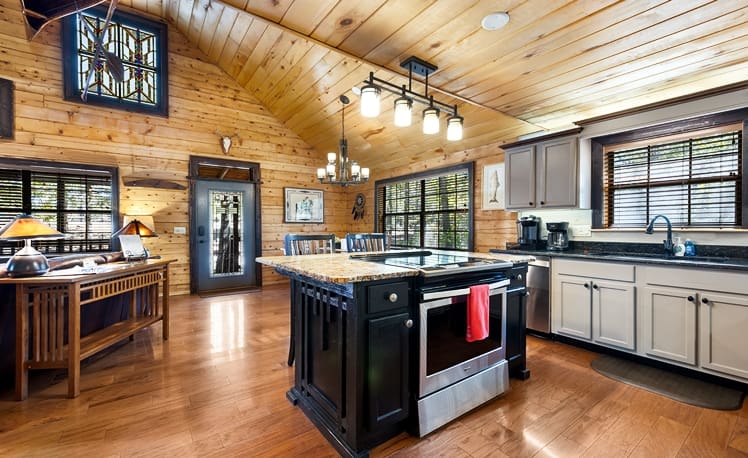 Kitchen with cooking island and seating