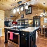 Kitchen with cooking island and seating