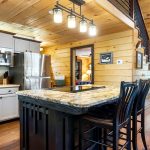 Kitchen with cooking island and seating