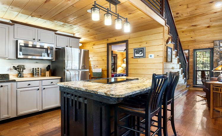 Kitchen with cooking island and seating