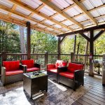 Back deck with outdoor seating and TV