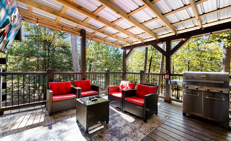 Back deck with outdoor seating and TV