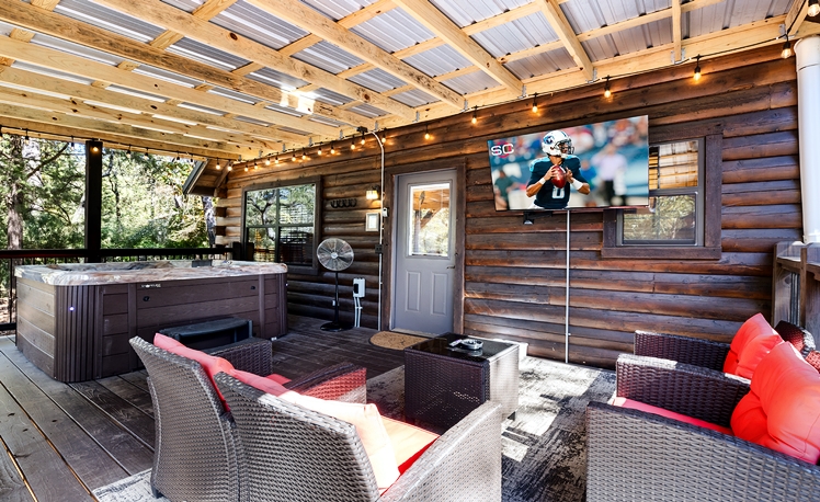 Back deck with hot tub and seating along with TV