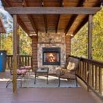 Fireplace with seating outside on covered deck