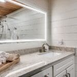 Bathroom with lighted mirror
