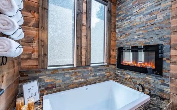 Bath tub with electric fireplace