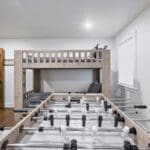 Bunk room with Foosball table