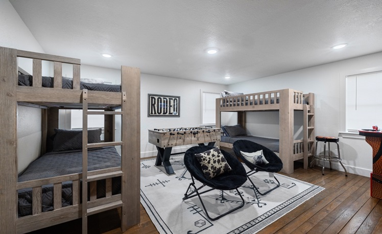 bunkbeds in bunk room with foosball table