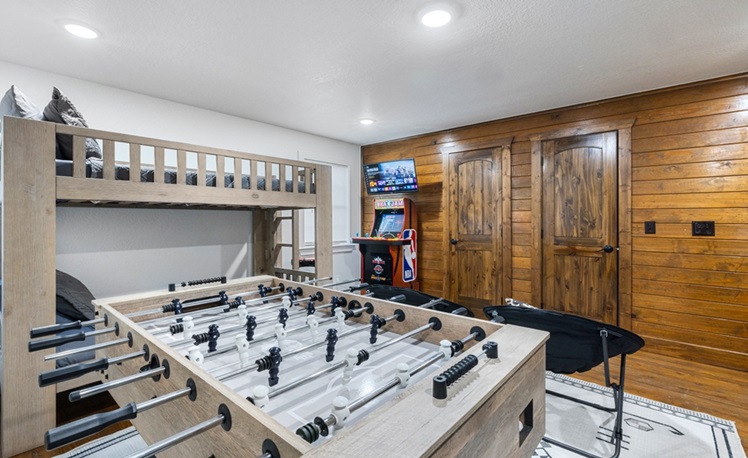 bunkbeds in bunk room with foosball table