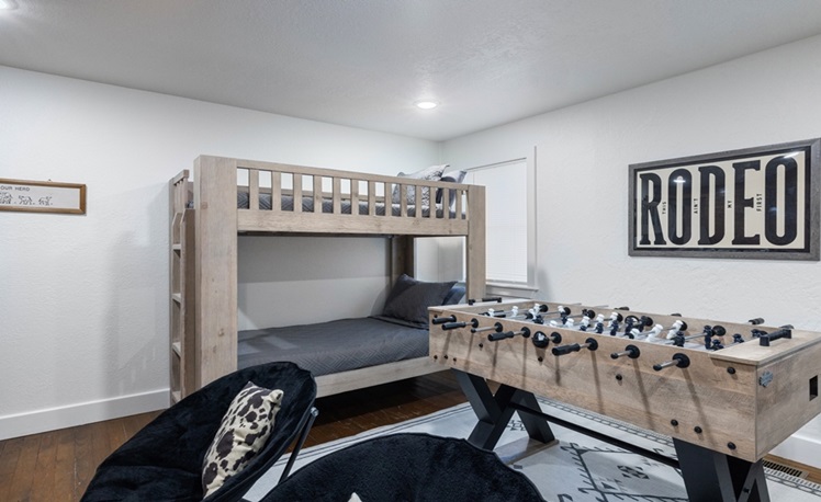 bunkbeds in bunk room with foosball table