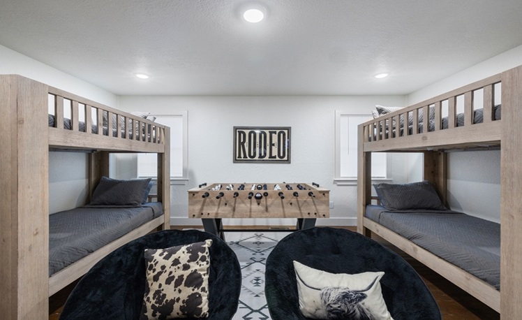bunkbeds in bunk room with foosball table