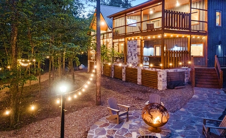 fire pit and back deck with string lights