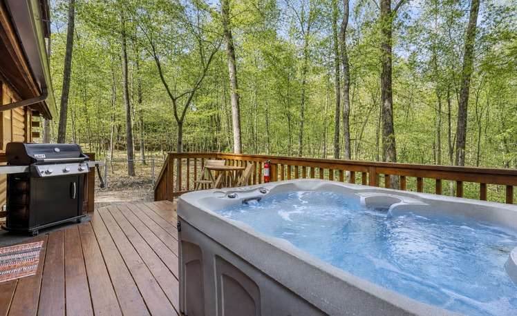 Hot tub on back deck forest cabin
