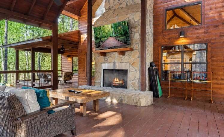 back deck with outdoor fireplace